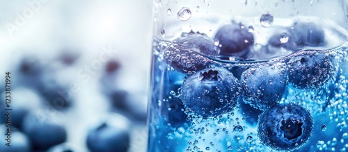 Wallpaper Mural Fresh blueberries submerged in sparkling water with bubbles in a glass, close-up view, with blurred blueberries in the background, Copy Space. Torontodigital.ca