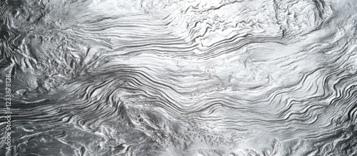 Abstract fluid pattern with swirling lines and textures in a silver and grey color palette photo