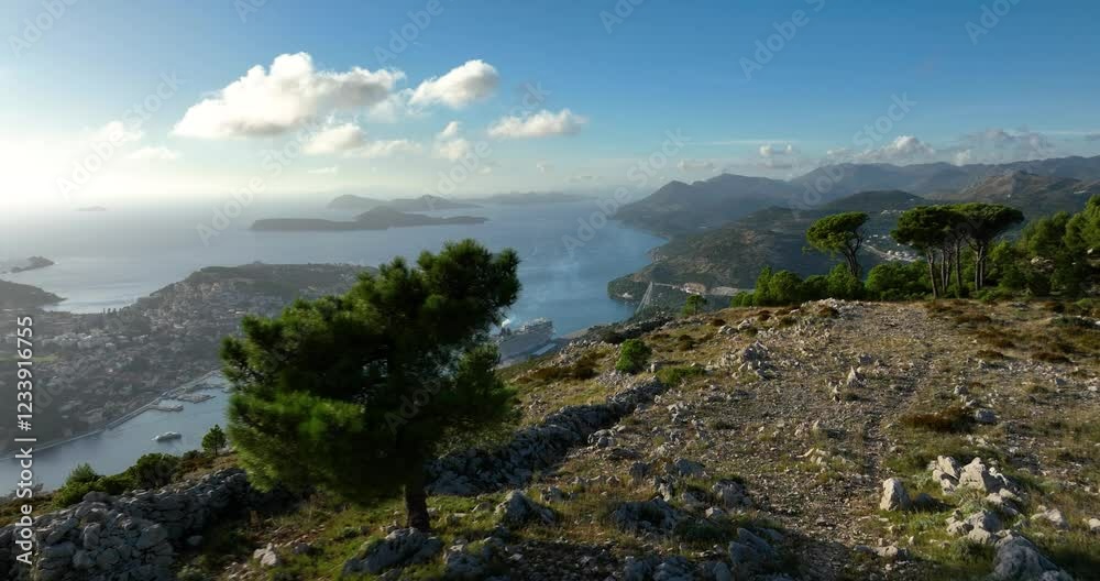 High altitude shot on top of a mountain looking down toward Dobrovnik, Croatia far below. High altitude shot on top of a mountain looking down toward Dobrovnik, Croatia far below.