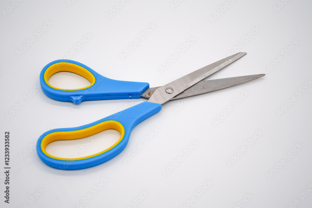 Stainless steel scissors with blue and yellow handles Stainless steel scissors with blue and yellow handles