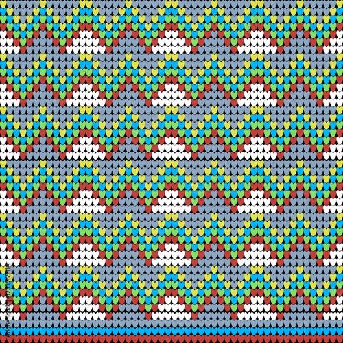 Seamless knitting triangles in yellow, red, and blue patterns. Vector Illustration. Design for cotton or thread sweaters, cotton or thread jumpers, carpets, blankets, and rugs.