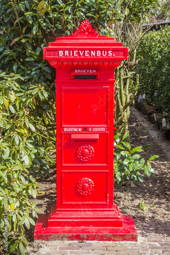 Obraz na płótnie Retro style red mail box in historic village Orvelte, Netherlands w salonie
