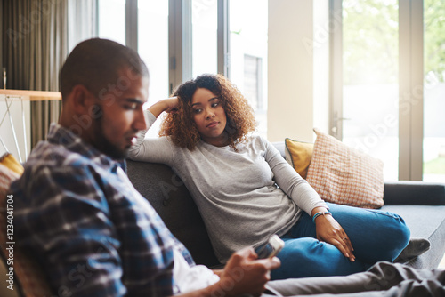 Couple, separation or fight with argument on sofa for disagreement, conflict or living room dispute at home. Upset woman, man or cheating affair with phone for breakup, divorce or toxic relationship