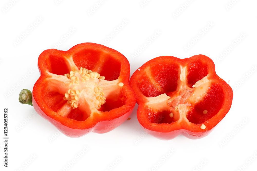 A red bell pepper cut in half, isolated on a white background A red bell pepper cut in half, isolated on a white background