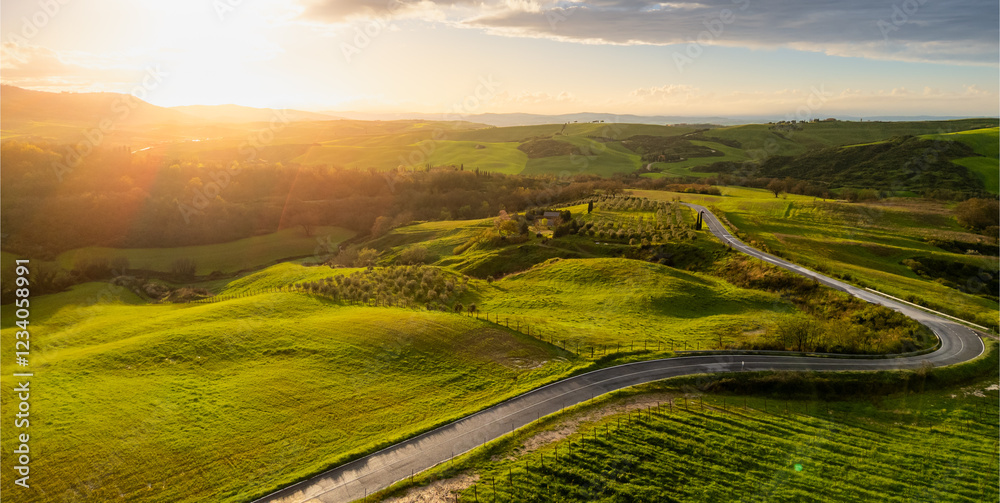 Aerial view of Tuscan hills at sunset, Italy.
