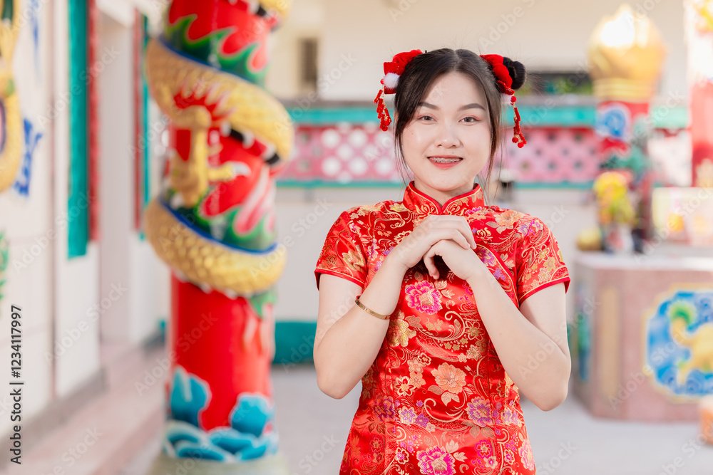 Asian Chinese women praying at shrine, pay homage fortune in Chinese New Year festival activity Asian Chinese women praying at shrine, pay homage fortune in Chinese New Year festival activity