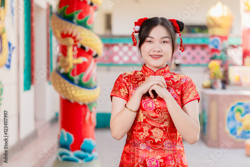 Asian Chinese women praying at shrine, pay homage fortune in Chinese New Year festival activity photo