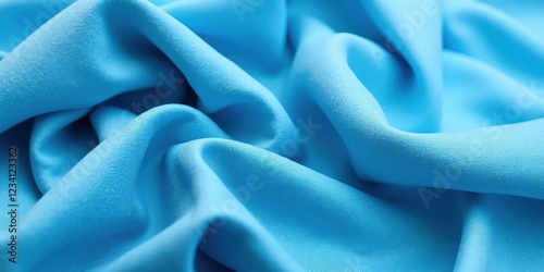 Soft, smooth light blue fabric with a subtle sheen and gentle wrinkles, exuding a vivid vibrancy in every fold photo