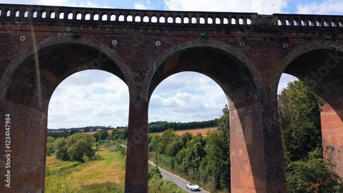 Elevated bridge construction, Victorian brickwork design, close-up photo