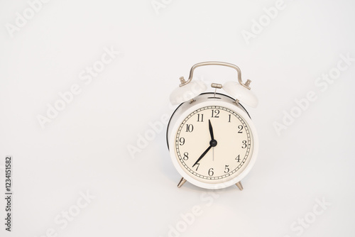 old alarm clock on a white Background . photo