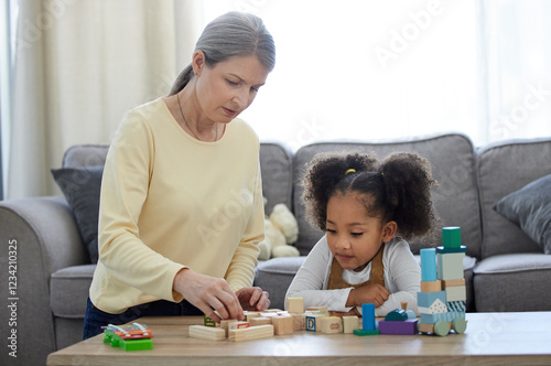 Psychologist, child and development with toys for education, learning behavior and assessment for adhd. Therapy, mature therapist and girl with blocks for autism, sensory skills and cognitive game