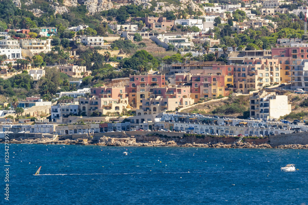 Fototapeta premium a beautiful cityscape view of Mellieha with the coastline of Mellieha Bay in Malta 
