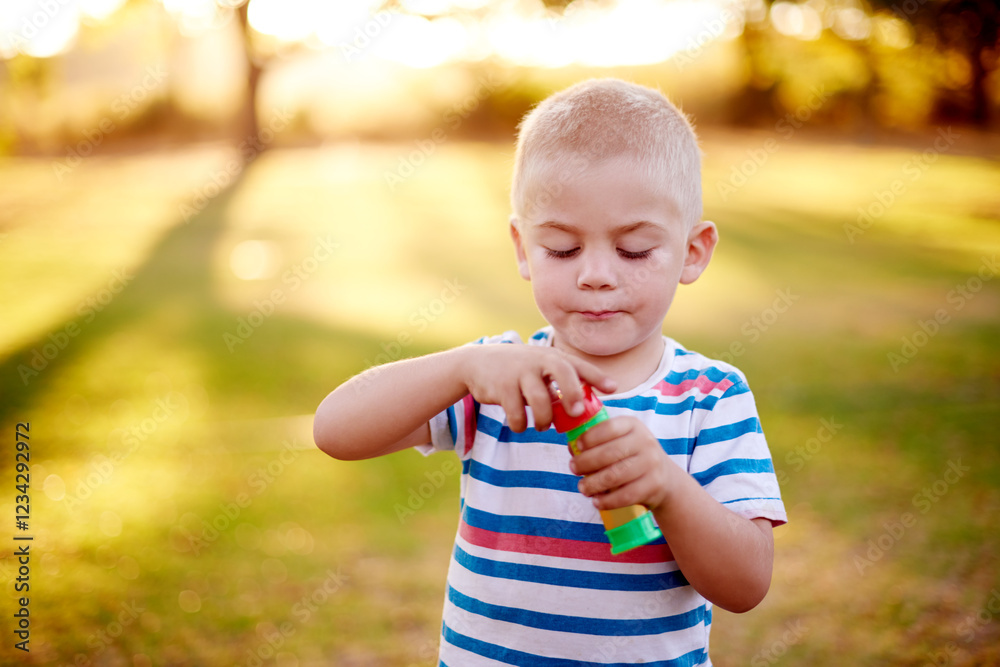 Bubbles, play and child in park with fun, sunset adventure and outdoor development for kids in nature. Relax, weekend and boy in garden playground with soap wand, childhood games and playful activity Bubbles, play and child in park with fun, sunset adventure and outdoor development for kids in nature. Relax, weekend and boy in garden playground with soap wand, childhood games and playful activity