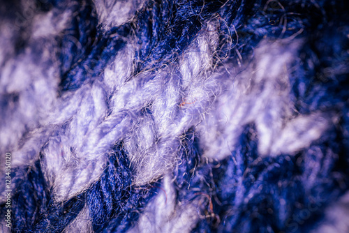 Wallpaper Mural A macro view of blue knitted fabric with a repeating white pattern, highlighting the intricate stitching and soft texture. The design creates a cozy and artistic feel. Torontodigital.ca