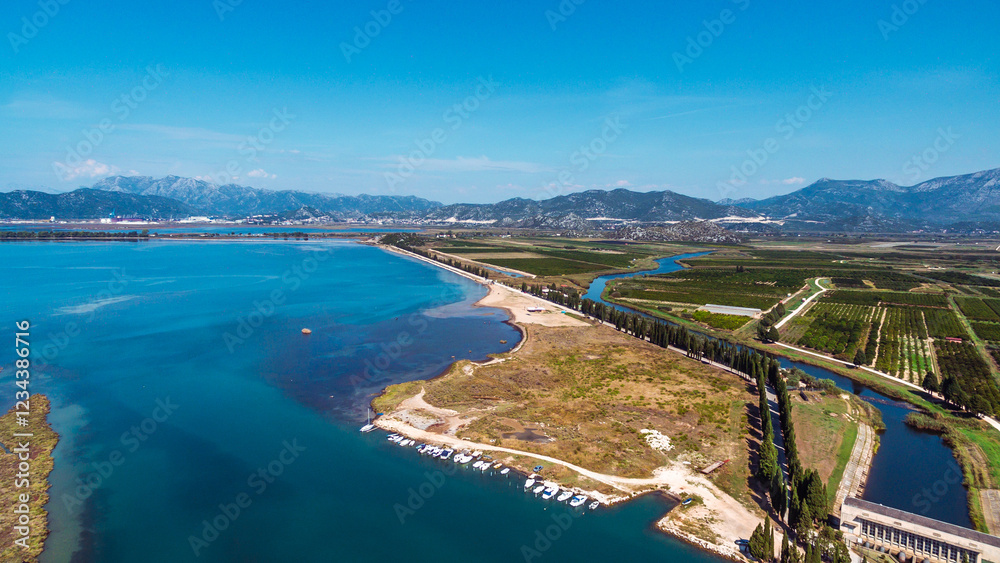 Naklejka premium Stunning Aerial View of Neretva River Estuary and Valley, Southern Croatia. Serene Wetlands, Scenic Landscapes