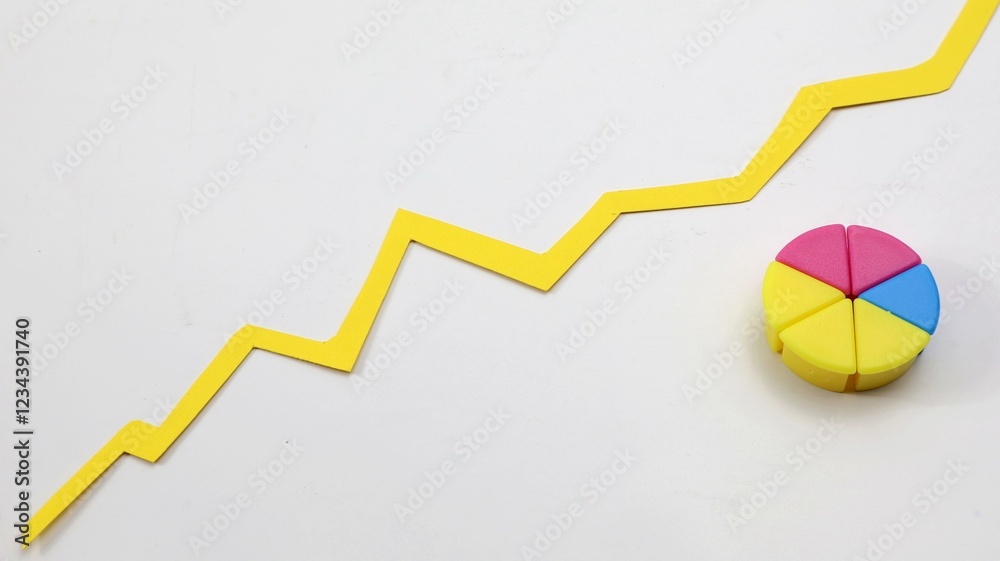 Fototapeta premium Pie chart made of colored wooden cubes with white background copy space.