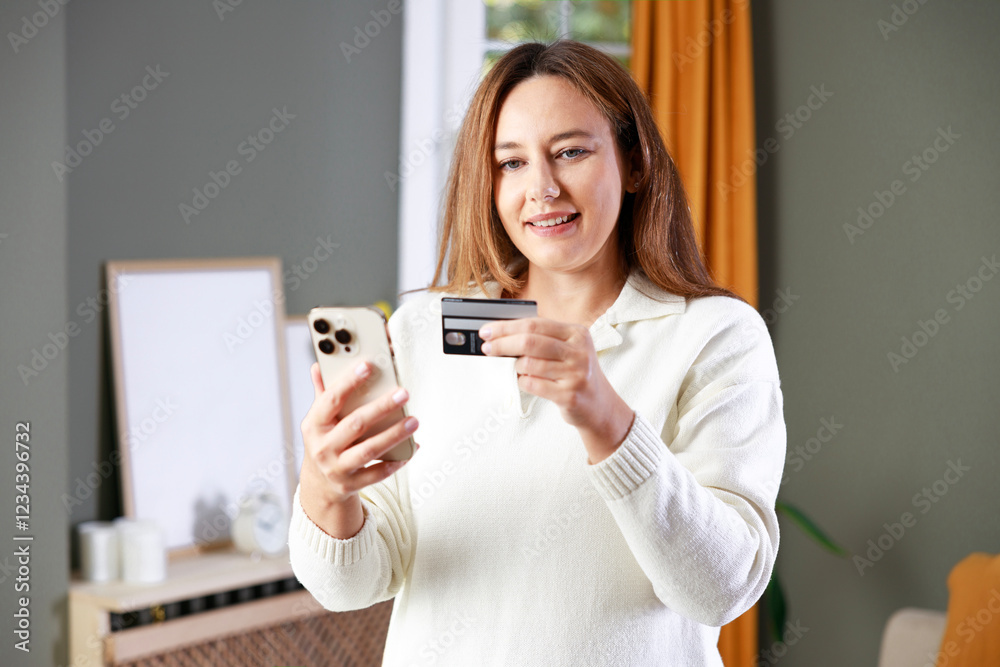 Young woman shopping online using smart phone and credit card Young woman shopping online using smart phone and credit card