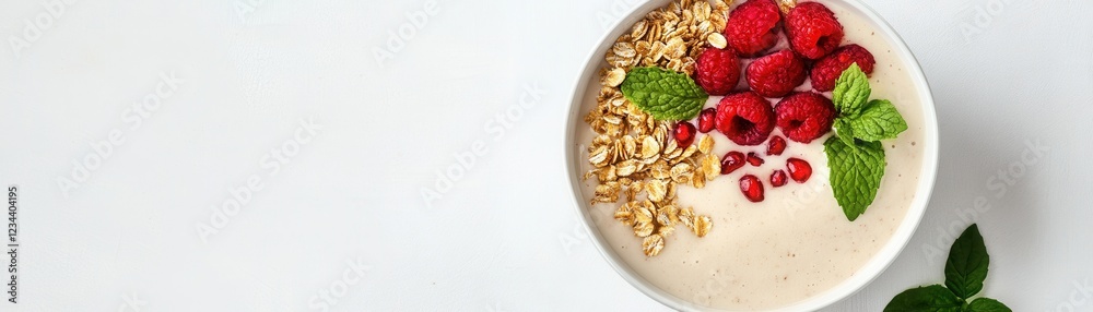 Fototapeta premium Deliciously vibrant smoothie bowl topped with fresh fruits, nuts, and seeds for a healthy breakfast.