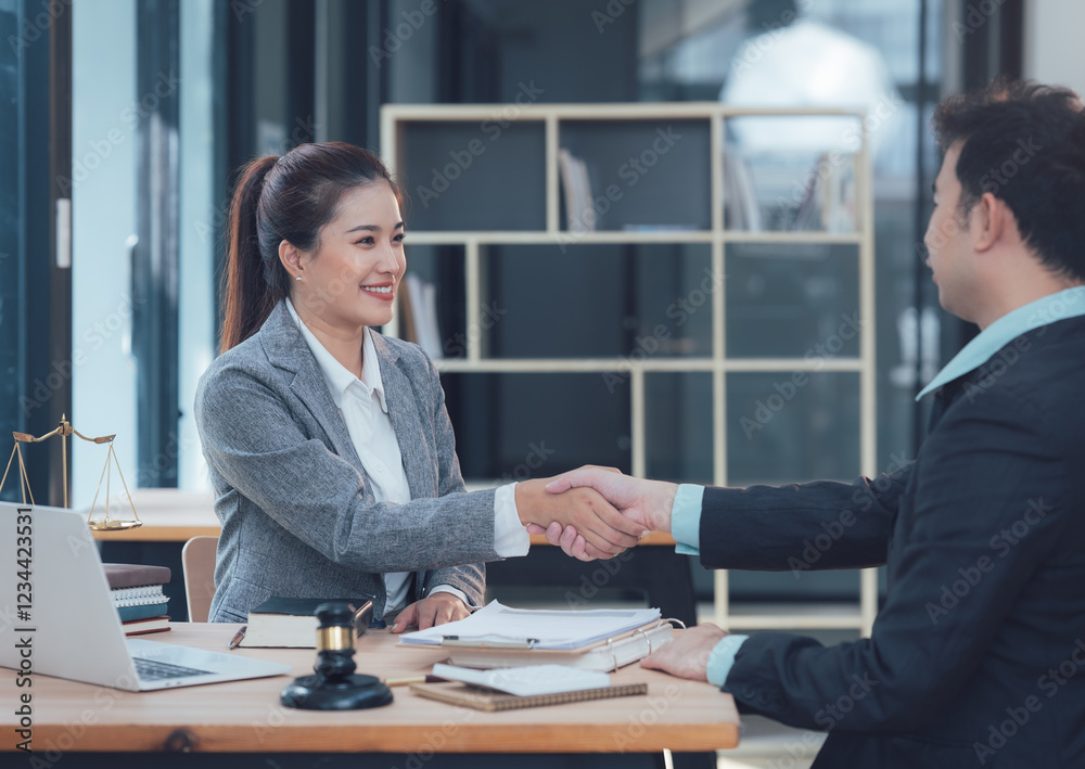 Successful Partnership: A confident businesswoman and a businessman seal a deal with a firm handshake in a modern office setting. The image portrays trust, collaboration and mutual success. Successful Partnership: A confident businesswoman and a businessman seal a deal with a firm handshake in a modern office setting. The image portrays trust, collaboration and mutual success.