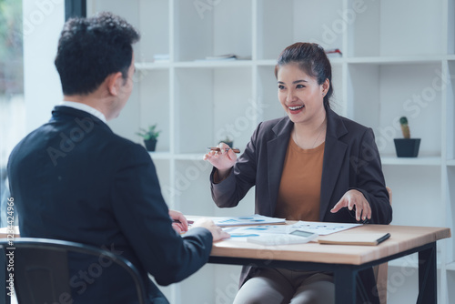 Businesswoman explaining a project to her colleague