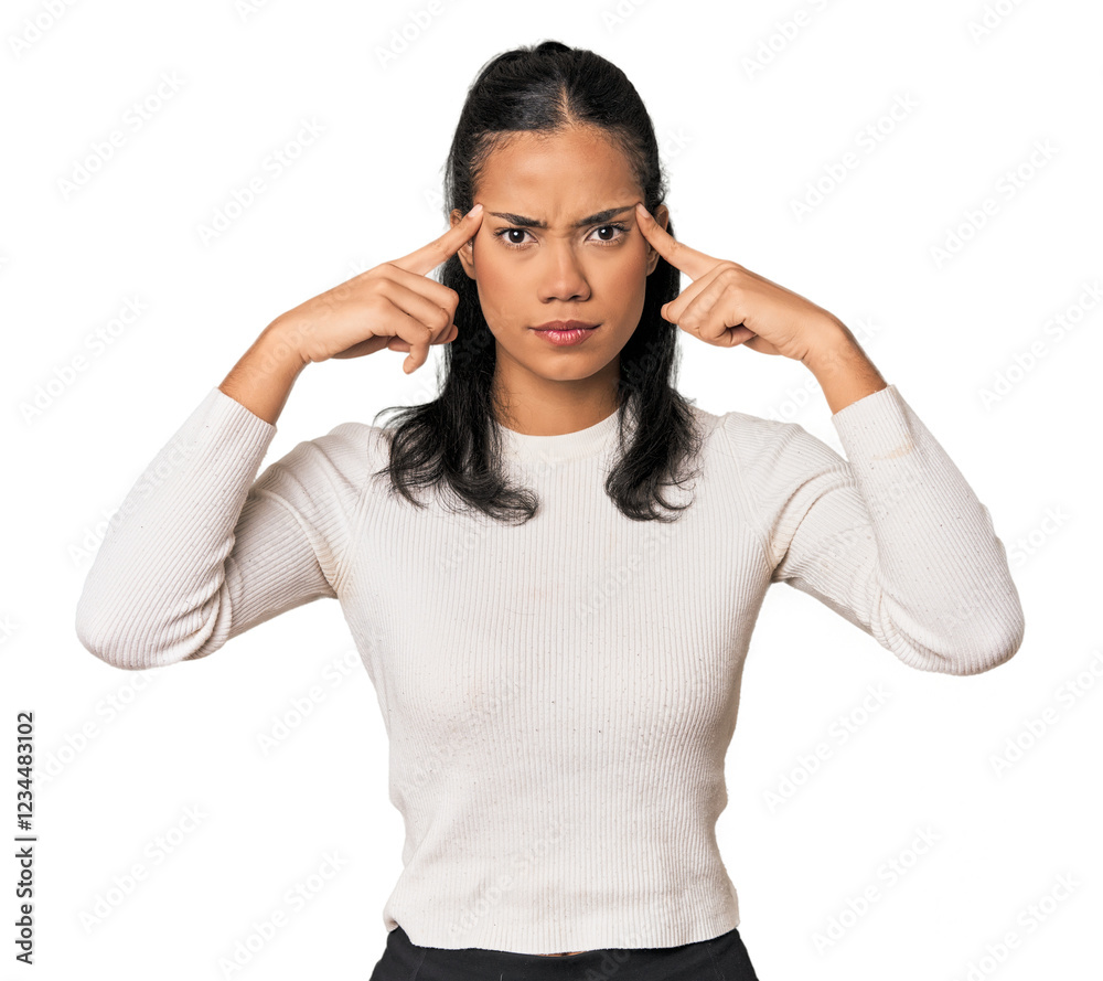 Young Filipina woman focused on a task, keeping forefingers pointing head. Young Filipina woman focused on a task, keeping forefingers pointing head.