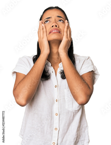 Young Filipina woman whining and crying disconsolately. photo