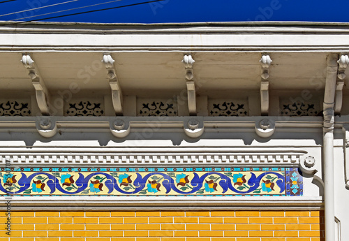 Obraz na płótnie Decorative strip with tiles on yellow facade in Petropolis, Rio de Janeiro, Brazil w salonie