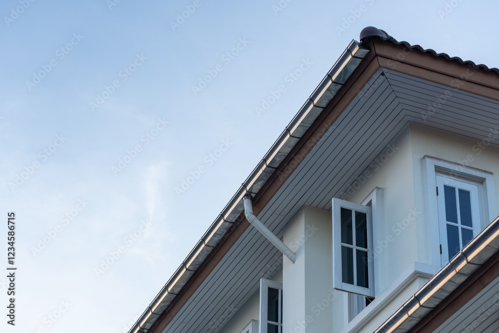 stainless steel rain gutter on the top of the house roof. stainless steel rain gutter on the top of the house roof.