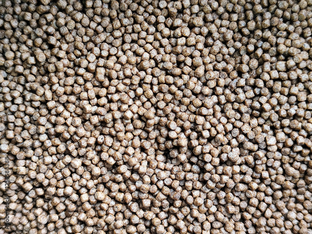 Fish concentrate is round in shape. Fish feed concentrate background. Fish concentrate is round in shape. Fish feed concentrate background.
