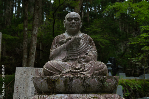 Statue of Kōbō-Daishi (“The child grandmaster”) in the Okunoin cemetery located on Mount Koya or Koyasan. Japan photo