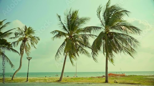 beach view with palm trees blue sky boats and sea clouds in the sky vacation island place 