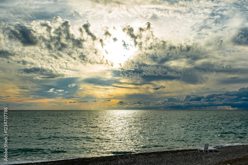 Picturesque sunset over the sea with dramatic clouds creating an unusual intriguing image. Black Sea end of summer