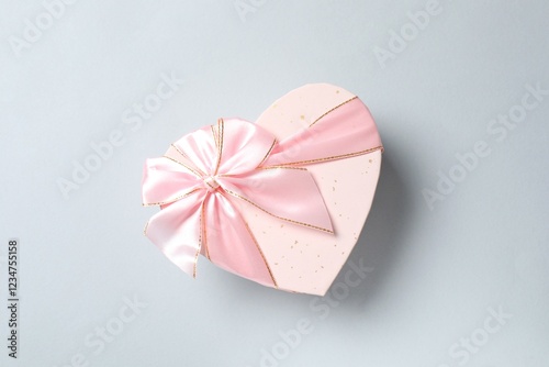 Beautiful pink gift box on gray background