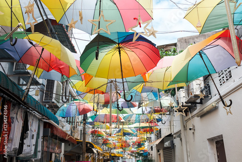 Beautiful and colorful umbrellas hanging above at George Town, Penang Island, Malaysia. One of favorite photo spot for tourist. Perfect as background or travel wallpaper