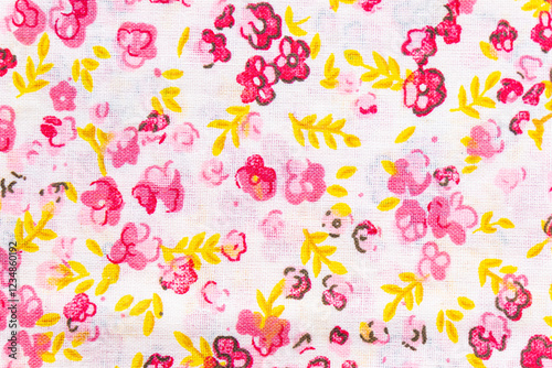 Pink floral fabric pattern showing small flowers and yellow leaves