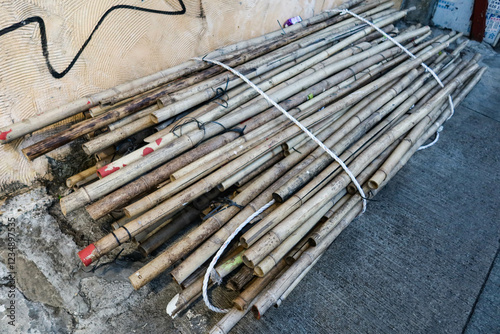 Canvas Print Close up of bamboo sticks in batches for constructing bamboo scaffolding in Hong Kong street daytime