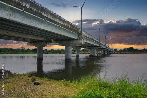 Kretek 2 Bridge Road on the Parangtritis South Java Cross-Island Route stretches across the horizon with decorative street lights. photo