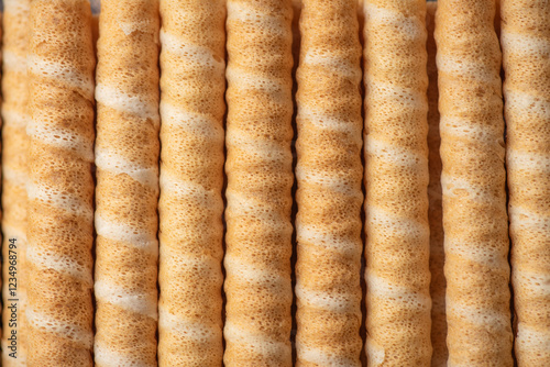 Obraz na płótnie Close-Up of Sweet Wafer Rolls in a Tidy Row w salonie