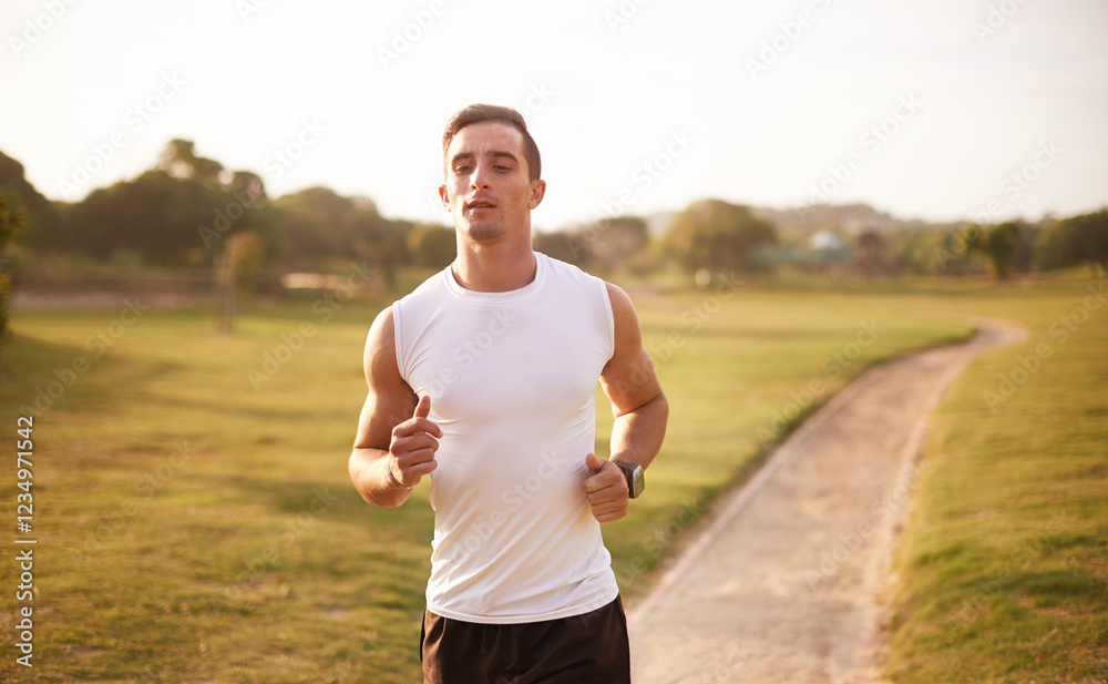 Fototapeta premium Nature, running and man with fitness on trail for workout, marathon training or endurance challenge. Sports, wellness and athlete person in park for morning cardio, performance or race in Cardiff