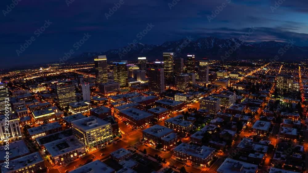 A breathtaking 4K ultra-HD stock video capturing the stunning skyline of Salt Lake City, Utah, at sunset, with the majestic Wasatch Mountains providing a dramatic and picturesque backdrop A breathtaking 4K ultra-HD stock video capturing the stunning skyline of Salt Lake City, Utah, at sunset, with the majestic Wasatch Mountains providing a dramatic and picturesque backdrop