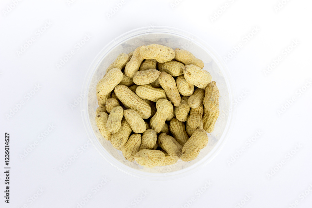 Peanut in bowl isolated on white background, top view. Peanut in bowl isolated on white background, top view.