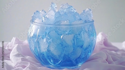 Blue Glass Bowl Filled with Ice Cubes on Pink Fabric