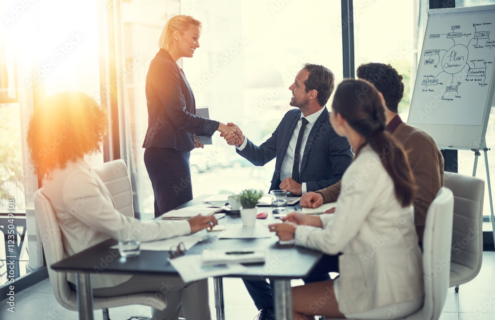 Handshake, success and contract with business people in meeting for deal merger, acquisition and thank you. Teamwork, loan agreement and banking firm with employees in office with lens flare Handshake, success and contract with business people in meeting for deal merger, acquisition and thank you. Teamwork, loan agreement and banking firm with employees in office with lens flare