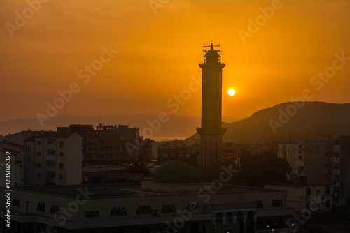 Muslim mosque for prayer and worship of Allah, Omar bin Abdul Aziz Mosque, Jijel State, Algeria, North African mosques in village on Mediterranean coast, Minaret and dome of mosque, Ramadan iftar.