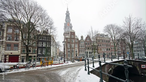 Amsterdam with the Zuiderkerk covered with snow  in winter in the Netherlands photo