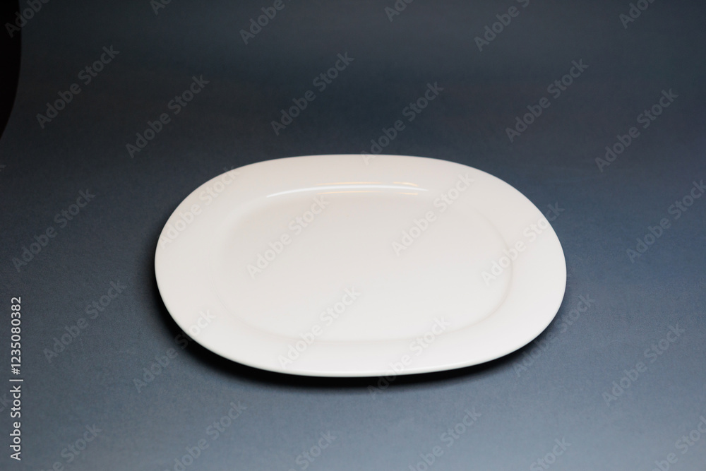 White plate on blue background White plate on blue background