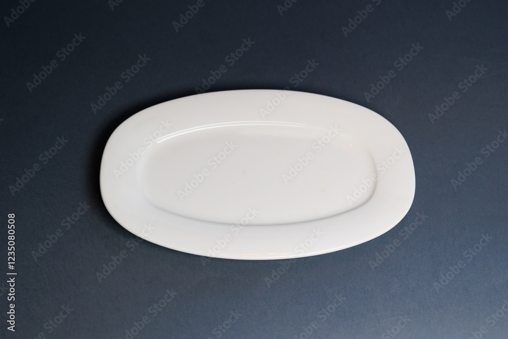 White plate on blue background White plate on blue background