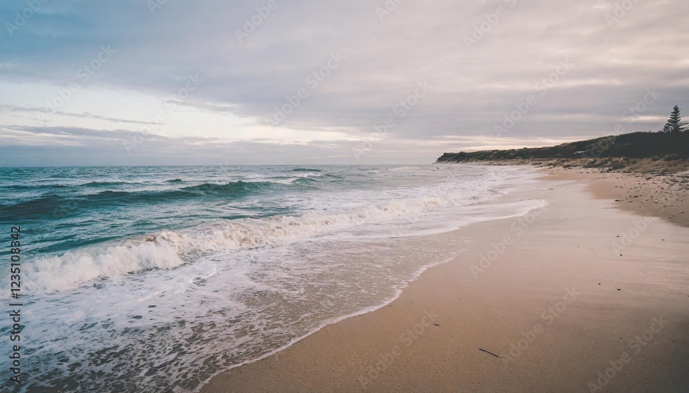 Empty Beach Captured at Sunset with Waves Crashing on Shore Empty Beach Captured at Sunset with Waves Crashing on Shore