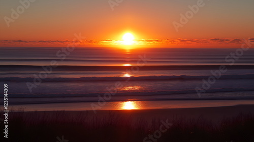 Majestic sunrise over the ocean, golden sun emerging from the horizon, vibrant sky with shades of orange, pink, and purple