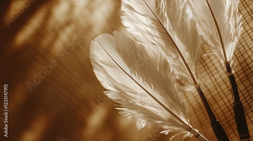 A close-up of feathered badminton shuttlecocks and a racket placed against a brown background photo